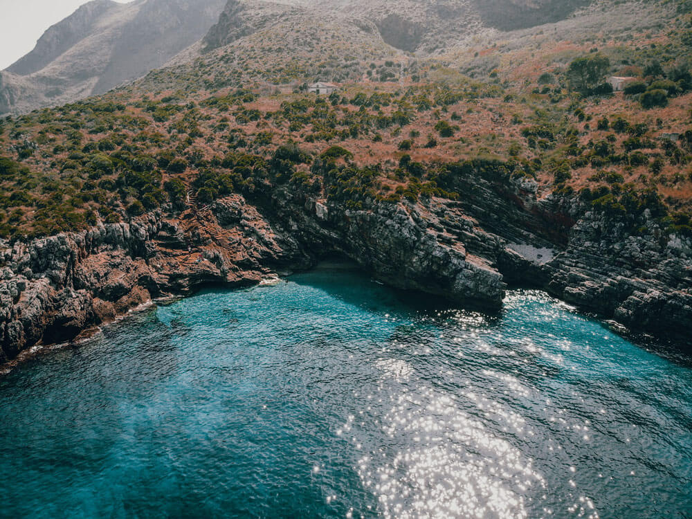 drone shot above zingaro reserve sicily