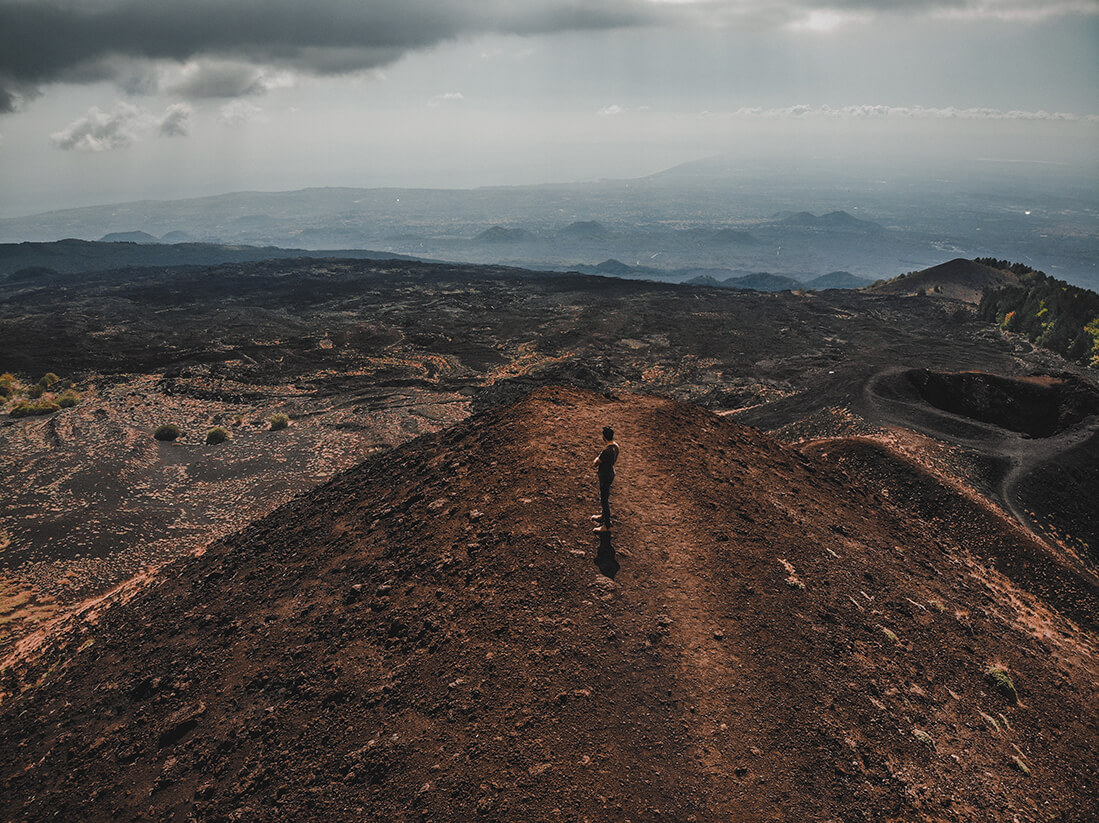 man standing on the Etna volcano area