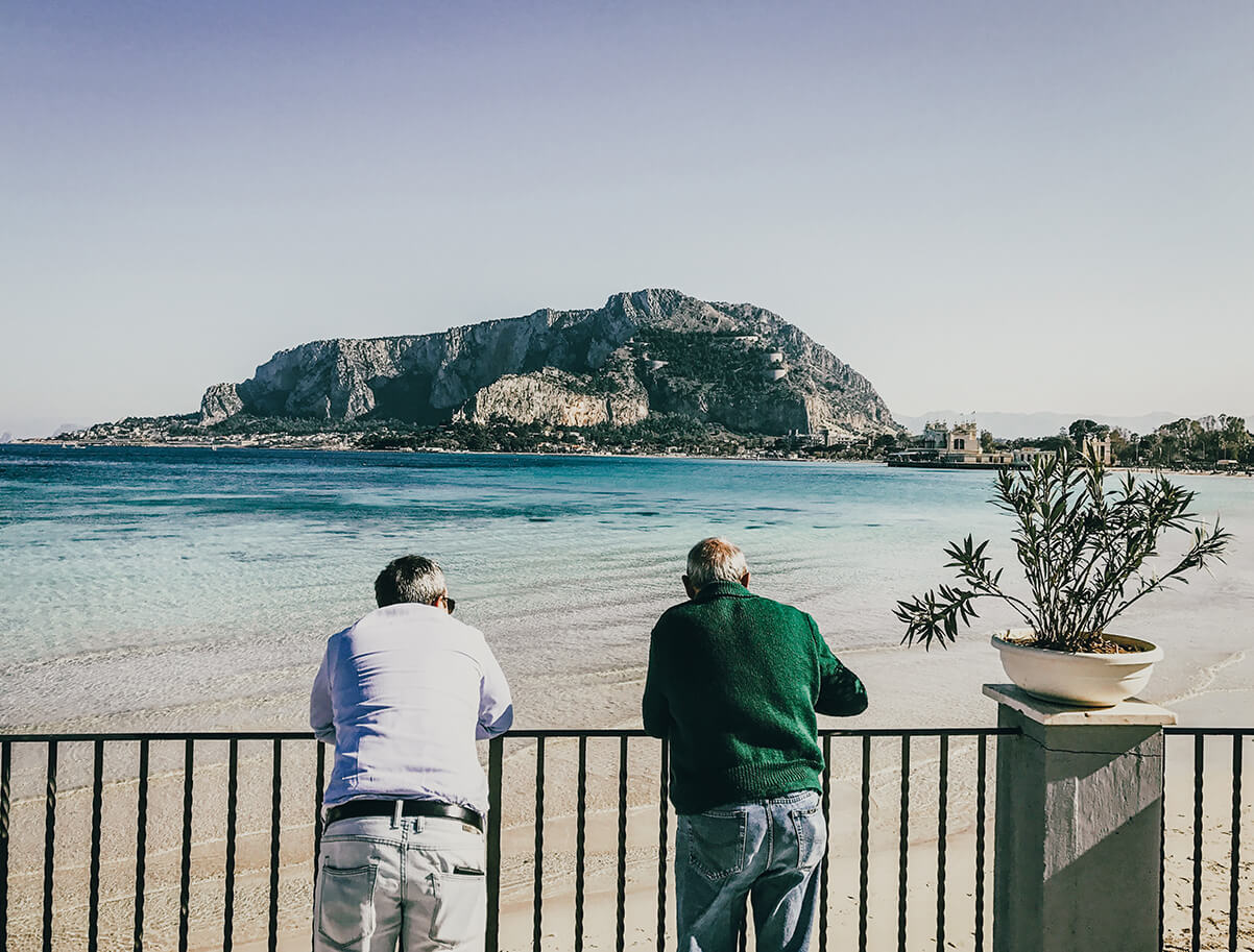 2 old mens looking at Mondello Beach in sicily