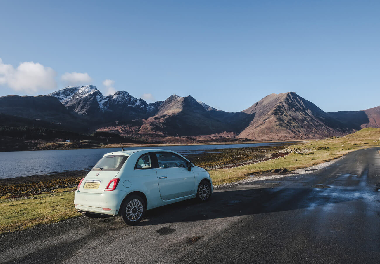 small car on the road of isle of skye