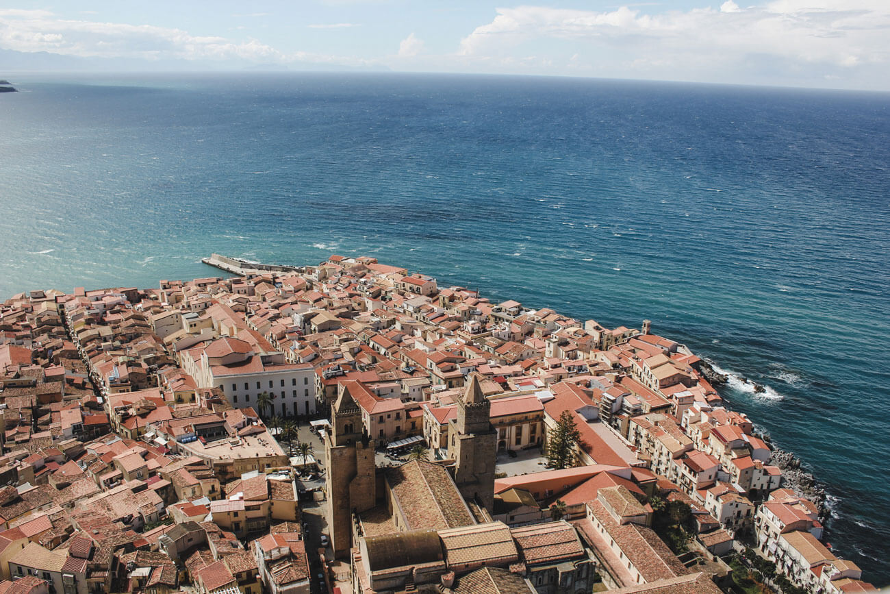 View point overlooking Cefalu town in Sicily and the ocean 