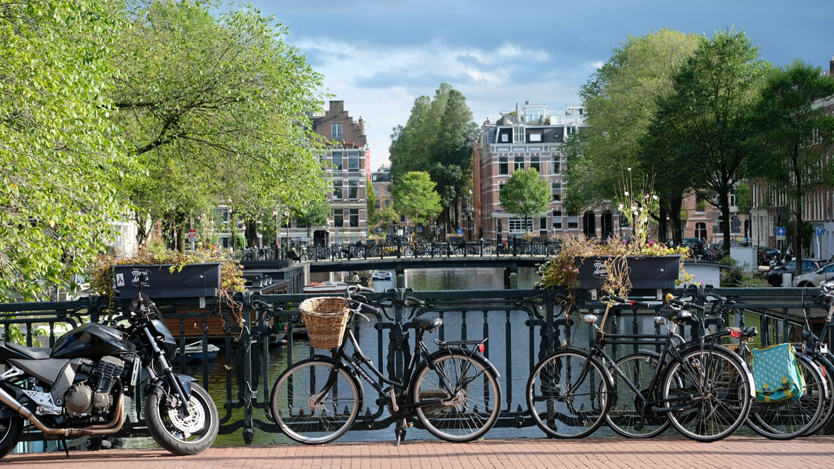 view of Amsterdam canal with bicycles 