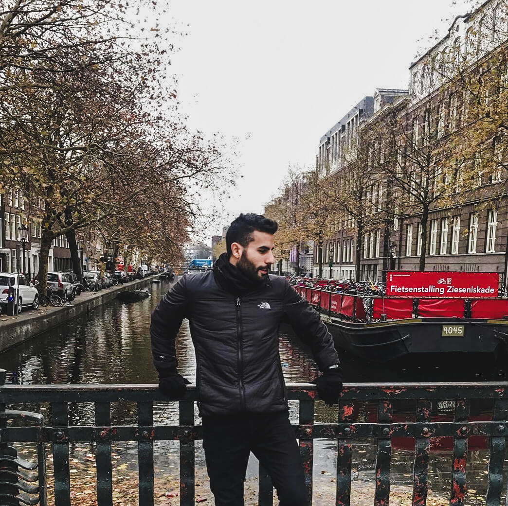 guy in Amsterdam with the canal view