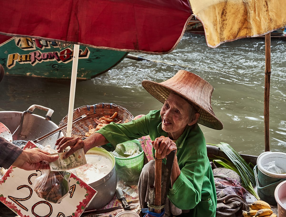 old lady in floating market in bangkok